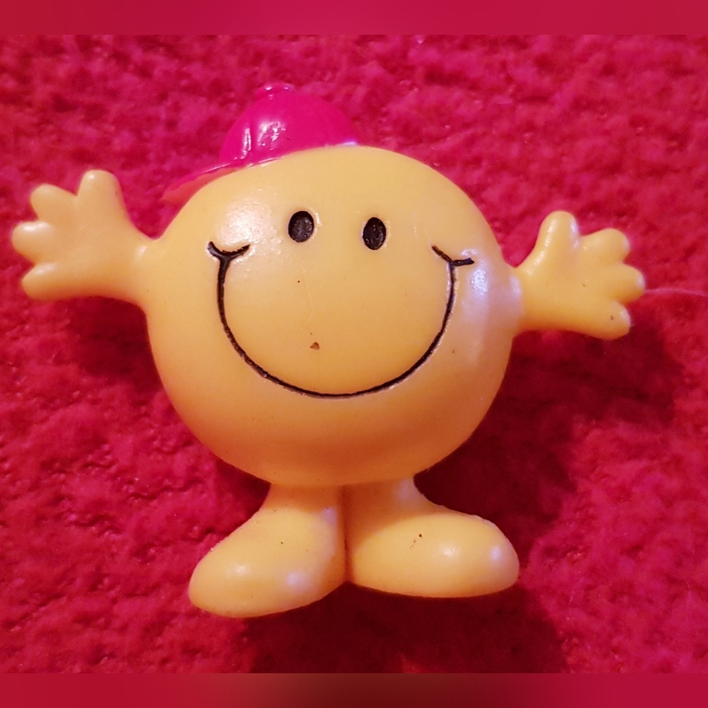 Smiling Yellow Toy Figure